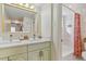 Bathroom featuring a double sink vanity with marble countertops and gold accents at 33 N Corona St # 401, Denver, CO 80218