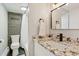 Bathroom featuring a granite vanity with a modern sink and fixtures, and a combination tub/shower at 33 N Corona St # 401, Denver, CO 80218