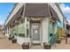 Front exterior view of Olivia's Restaurant, inviting patrons with its stylish facade and outdoor seating at 33 N Corona St # 401, Denver, CO 80218