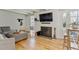 Spacious living room featuring fireplace, hardwood floors, and access to outdoor area at 33 N Corona St # 401, Denver, CO 80218