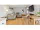 Comfortable living room boasts hardwood floors, fireplace, and a large sectional sofa at 33 N Corona St # 401, Denver, CO 80218