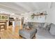 Open-concept layout showcasing living room leading into the bright, renovated kitchen with wood floors and recessed lighting at 33 N Corona St # 401, Denver, CO 80218