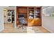 Built-in wooden desk area with shelving, drawers, and adjacent laundry area at 33 N Corona St # 401, Denver, CO 80218