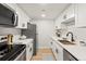 The updated kitchen features sleek countertops, modern appliances, and ample cabinet space at 7770 W 38Th Ave # 108, Wheat Ridge, CO 80033