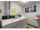 A common laundry room featuring two washing machines, two dryers, and a laundry care guide at 7770 W 38Th Ave # 108, Wheat Ridge, CO 80033
