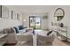 Comfortable living room featuring a sofa, chairs, and a sliding glass door to the outside at 7770 W 38Th Ave # 108, Wheat Ridge, CO 80033