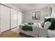This main bedroom offers a serene retreat with plush bedding, natural light, and ample closet space at 7770 W 38Th Ave # 108, Wheat Ridge, CO 80033