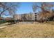 Community pool area surrounded by a wrought iron fence and apartment buildings at 7770 W 38Th Ave # 108, Wheat Ridge, CO 80033