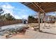 Spacious backyard with pergola, patio, fire pit, and storage shed at 806 Ridgemont Cir, Highlands Ranch, CO 80126