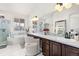 Spa-like bathroom with double vanity, soaking tub, and walk-in shower at 806 Ridgemont Cir, Highlands Ranch, CO 80126