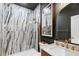 Modern bathroom with marble shower and a stylish vanity at 806 Ridgemont Cir, Highlands Ranch, CO 80126