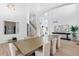 Open concept dining room with hardwood floors and large windows at 806 Ridgemont Cir, Highlands Ranch, CO 80126