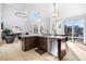 Modern kitchen with island, stainless steel appliances, and access to backyard at 806 Ridgemont Cir, Highlands Ranch, CO 80126