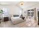 Large bedroom with plush carpet, private deck access, and ensuite bath at 806 Ridgemont Cir, Highlands Ranch, CO 80126