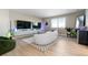 Modern media room with two large TVs and a comfortable lounge area at 806 Ridgemont Cir, Highlands Ranch, CO 80126