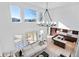 Open concept living and kitchen area with high ceilings and mountain views at 806 Ridgemont Cir, Highlands Ranch, CO 80126