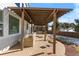 Outdoor kitchen and pergola with built-in grill at 806 Ridgemont Cir, Highlands Ranch, CO 80126