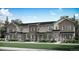 Attractive townhome exterior boasts a combination of stone and siding accents, plus well-maintained landscaping at 1967 S Haleyville Way, Aurora, CO 80018