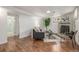 Finished basement with a painted brick fireplace and seating at 7828 Florado St, Denver, CO 80221