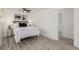 Cozy bedroom featuring modern decor, wood-look flooring, and ample space at 7828 Florado St, Denver, CO 80221