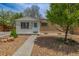 Charming home featuring a well-manicured front yard with easy access and drought-resistant landscaping at 7828 Florado St, Denver, CO 80221