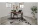 Bright office space with wood desk, stylish floor covering, and plant at 7828 Florado St, Denver, CO 80221