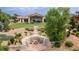 Aerial view showcasing the backyard, fire pit, lush landscaping, and lake access at 5767 Pelican Shores Dr, Longmont, CO 80504