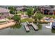 Aerial view capturing the waterfront property, private dock, landscaped yard, and neighborhood at 5767 Pelican Shores Dr, Longmont, CO 80504