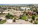 Expansive aerial view of an elegant home, highlighting its lush backyard and access to a beautiful community lake at 5767 Pelican Shores Dr, Longmont, CO 80504