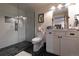 Stylish bathroom with glass walk-in shower, herringbone tile, and modern fixtures at 5767 Pelican Shores Dr, Longmont, CO 80504