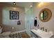 Well-appointed guest bathroom featuring a stand-up shower, unique decor, and stylish fixtures at 5767 Pelican Shores Dr, Longmont, CO 80504