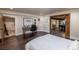 Bedroom space with hardwood floors and office space with white board and work space at 5767 Pelican Shores Dr, Longmont, CO 80504