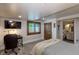 Bedroom space with carpet flooring and office space with window and home decor at 5767 Pelican Shores Dr, Longmont, CO 80504