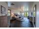 Spacious primary bedroom with a seating area, hardwood floors, and a view of the outdoors at 5767 Pelican Shores Dr, Longmont, CO 80504