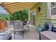 Relaxing back deck featuring an awning, ample seating, and easy access to the home's interior and outdoor amenities at 7840 S Windermere Cir, Littleton, CO 80120