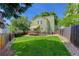 Well-maintained backyard featuring a wooden deck, lush lawn, and privacy fence ideal for outdoor enjoyment at 7840 S Windermere Cir, Littleton, CO 80120