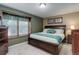 Relaxing bedroom with a window seat and calming color scheme at 7840 S Windermere Cir, Littleton, CO 80120
