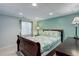 Bedroom features a comfortable bed, natural light from the window, and calming wall color at 7840 S Windermere Cir, Littleton, CO 80120