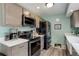 Well-equipped kitchen with stainless steel appliances, and neutral cabinetry at 7840 S Windermere Cir, Littleton, CO 80120