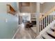 Inviting living room featuring a stone fireplace and rustic wood flooring at 7840 S Windermere Cir, Littleton, CO 80120