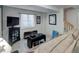 Cozy living room features a television, carpeted floors, and a window for natural light at 7840 S Windermere Cir, Littleton, CO 80120
