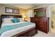 Comfortable bedroom with a large dresser and soft, inviting decor at 7840 S Windermere Cir, Littleton, CO 80120