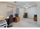 Spacious home office with two windows allowing for lots of natural light at 7840 S Windermere Cir, Littleton, CO 80120