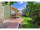 Charming patio with awning, leading to a landscaped yard, perfect for relaxing and entertaining at 7840 S Windermere Cir, Littleton, CO 80120