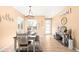A cozy dining room with modern decor, a rustic table, and an abundance of natural light at 11052 Sedalia St, Commerce City, CO 80022
