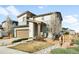 Charming two-story home with a two-car garage and a beautifully landscaped front yard at 11052 Sedalia St, Commerce City, CO 80022