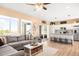 Spacious living area with an open floor plan, a large sectional sofa, and easy access to the kitchen at 11052 Sedalia St, Commerce City, CO 80022