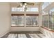Bright bedroom with large windows and ceiling fan, showcasing natural light and airy space at 13792 E Lehigh Ave # E, Aurora, CO 80014