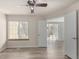 This bedroom has sleek floors, neutral walls, and big windows at 13792 E Lehigh Ave # E, Aurora, CO 80014