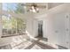 Bedroom with large windows, great natural light, ceiling fan, and hardwood-style floors at 13792 E Lehigh Ave # E, Aurora, CO 80014